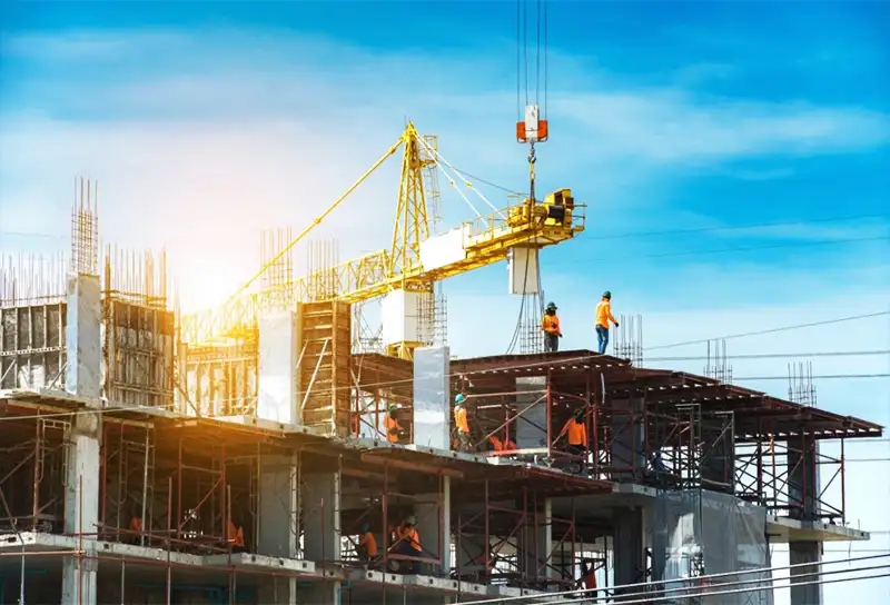 Workers tying steel reinforcement on site
